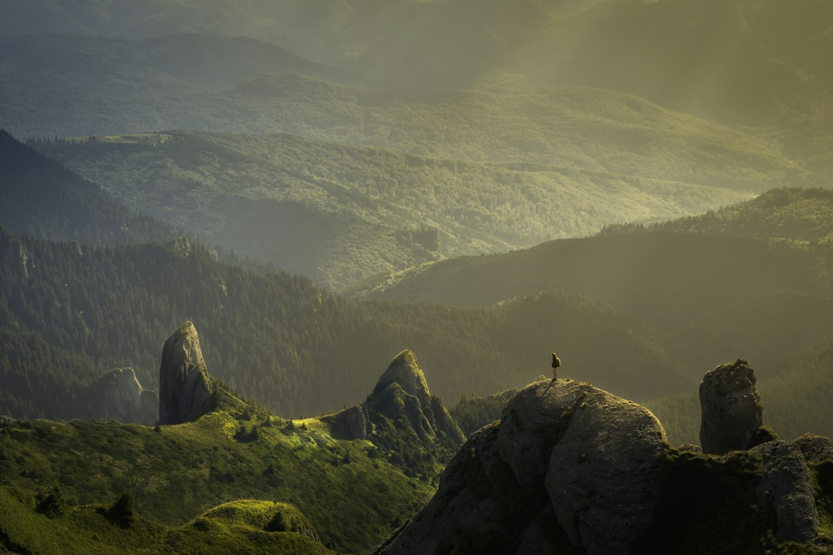 Sunlight falling across a broad mountain landscape